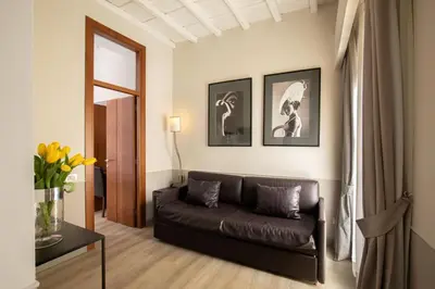 a living room with a couch and a table at Condotti Palace in Rome
