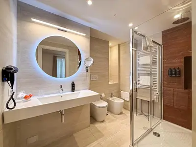 a bathroom with a sink and a mirror at Albergo Abruzzi in Rome
