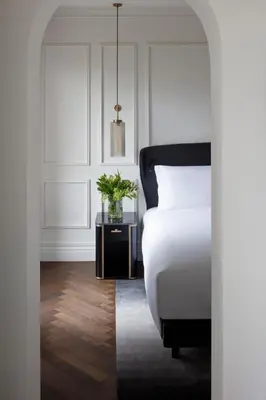a bedroom with a bed and a plant on a table at InterContinental Rome Ambasciatori Palace by IHG in Rome