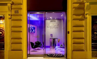 a room with a glass door with a chair in it at SuiteSistina for Brave Lovers in Rome