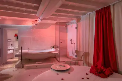 a large bathroom with a tub and a sink at SuiteSistina for Brave Lovers in Rome