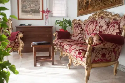 a living room with a couch and a table at Hotel Antico Acquedotto in Rome