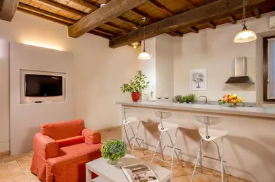a living room with a bar and a couch at Boutique Hotel Campo de' Fiori in Rome