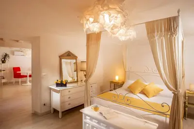 a bedroom with a canopy bed and a mirror at Boutique Hotel Campo de' Fiori in Rome