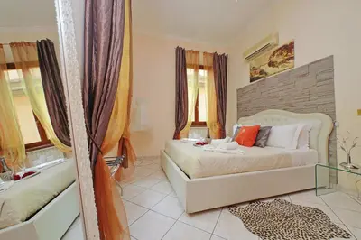a bedroom with a bed and a tub in it at Luxury Domus in Rome