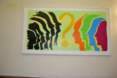 a painting hanging on a white wall at Dipendenza Hotel Galileo in Rome
