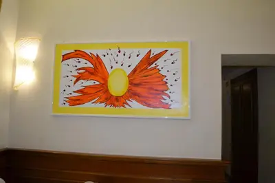 a painting of a flower on a wall at Dipendenza Hotel Galileo in Rome