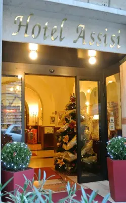 a store front with a christmas tree in front of it at Hotel Assisi in Rome
