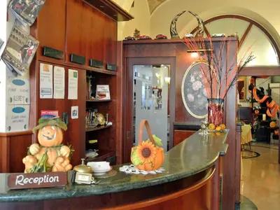 a counter in a store with pumpkins on it at Hotel Assisi in Rome