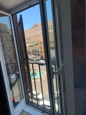 a view of a city from a window at Suite Artis Barberini in Rome