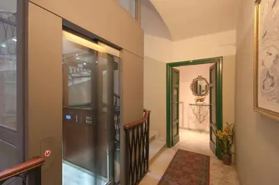 a hallway with a glass door and a stairway at Hotel Silla in Rome