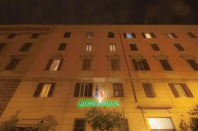 a building with a sign on the front of it at Hotel Silla in Rome