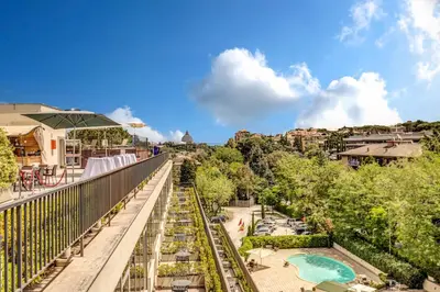 a view from the balcony of a resort with a pool at Cardinal Hotel St. Peter in Rome