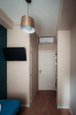 a room with a hallway with a door and a lamp at Hotel Domus Tiberina in Rome