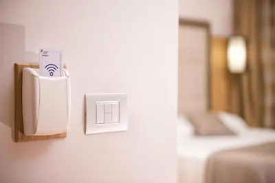 a light switch on a wall in a room at Hotel Giolli Nazionale in Rome