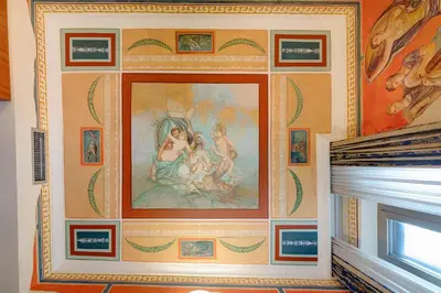 a painting on a wall in a room at Hotel Amalfi in Rome