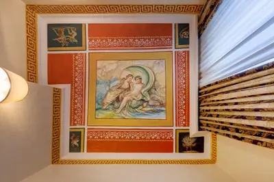 a painting on a wall in a room at Hotel Amalfi in Rome