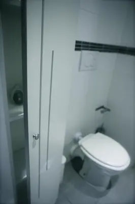 a bathroom with a white toilet and a shower at Arts & Rooms in Rome