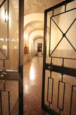 a glass door with a hallway in a building at Arts & Rooms in Rome