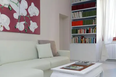 a living room with a couch and a coffee table at RomeAsYouLike-Colosseo Experience45 in Rome