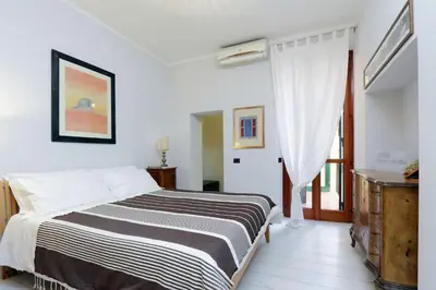 a bedroom with a bed and a window at RomeAsYouLike-Colosseo Experience45 in Rome