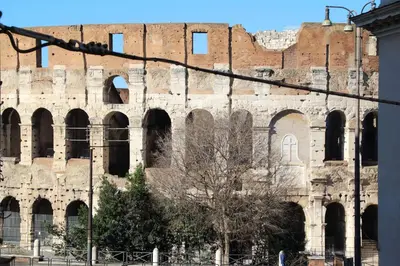 an old brick building with arches and windows at RomeAsYouLike-Colosseo Experience45 in Rome