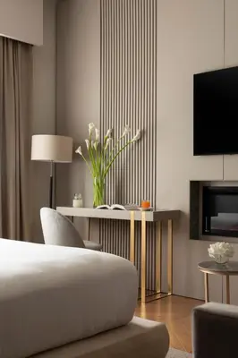 a bedroom with a bed with a lamp and a chair at Palazzo Venere in Rome