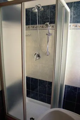 a shower in a bathroom with a sink at Città Eterna Guest House in Rome