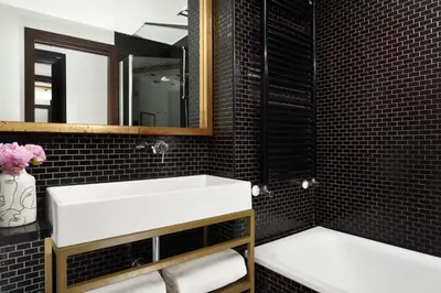 a bathroom with a white sink and a mirror at Hotel Pulitzer in Rome