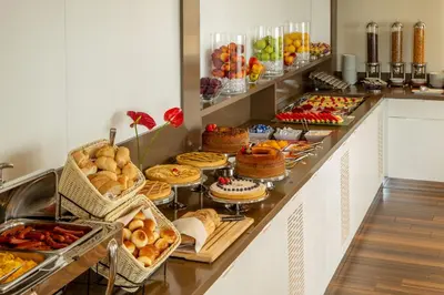 a buffet line with many different types of food at Hotel Gioberti in Rome