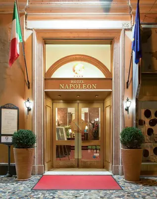 a front door of a marriott napleton building at Hotel Napoleon in Rome