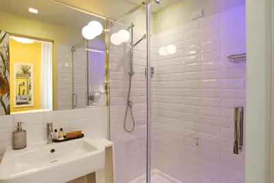 a bathroom with a sink and a glass shower at Hotel Elite in Rome