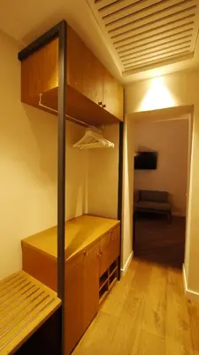 a room with a closet with a bed and a couch at Hotel Elite in Rome