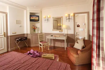 a living room with a couch and a table at Hotel Villa Glori in Rome
