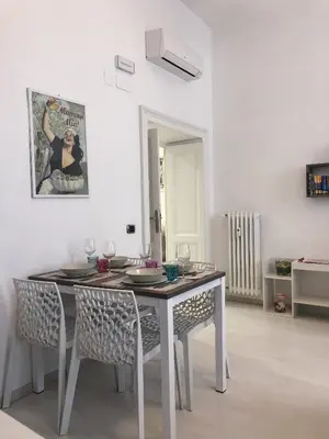 a dining room with a table and some chairs at Rome Holiday Home in Rome