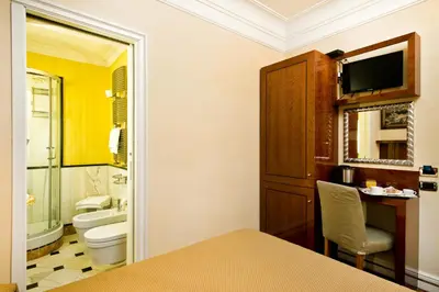 a bathroom with a toilet and a sink at Suite Opera Rooms in Rome