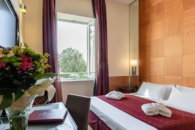 a hotel room with a bed and a window at Kolbe Hotel Rome in Rome