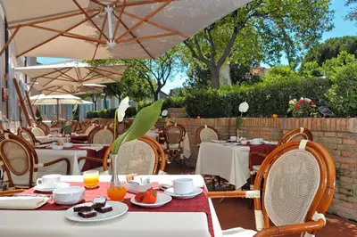 a table with plates of food on top at Kolbe Hotel Rome in Rome
