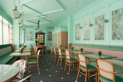 a row of tables and chairs in a restaurant at Hotel Degli Aranci in Rome