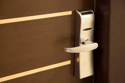 a close up of a wooden door with a door knob at Hotel Buenos Aires in Rome