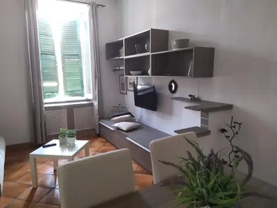 a living room with a couch and a tv at Testaccio comodo appartamento in Rome