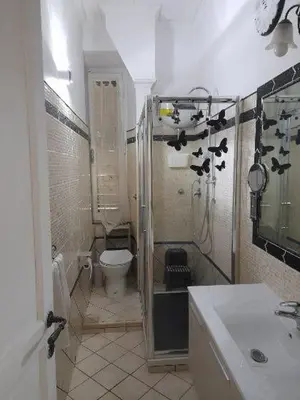 a bathroom with a shower and a toilet and a sink at Testaccio comodo appartamento in Rome