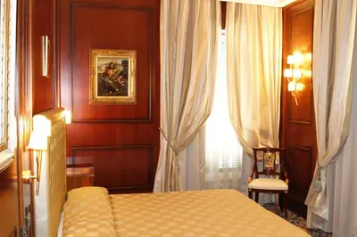 a hotel room with a bed and a window at Boutique Hotel Trevi in Rome