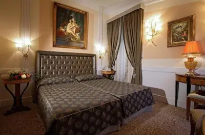 a bedroom with a large bed in a room at Boutique Hotel Trevi in Rome