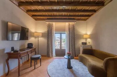 a living room with a couch and a table at Donna Camilla Savelli - VRetreats in Rome