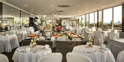 a dining room with white tables and white chairs at Hotel Splendide Royal - The Leading Hotels of the World in Rome