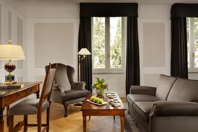 a living room with a couch and a table at Hotel Splendide Royal - The Leading Hotels of the World in Rome
