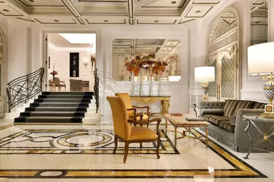 a lobby with a staircase and a living room at Hotel Splendide Royal - The Leading Hotels of the World in Rome