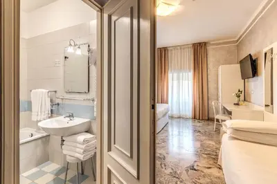 a bathroom with a sink and a toilet at Hotel Orazia in Rome