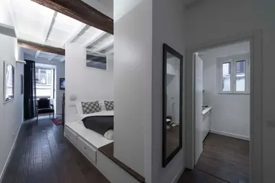 a bedroom with a bed and a mirror at EasyInRome Navona in Rome
